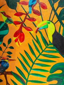 a painting of a yellow bird with aemed at Inngo Tourist Inn in El Nido