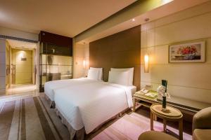 Voodi või voodid majutusasutuse Hotel Nikko Saigon toas