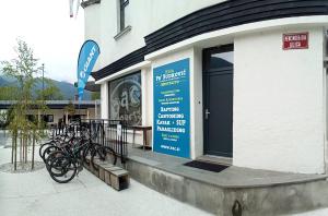 a group of bikes parked outside of a building at House Budkovič in Bohinj