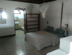 Ένα ή περισσότερα κρεβάτια σε δωμάτιο στο Hotel Restaurant Hellenique Appartements
