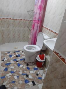 a bathroom with a toilet and a sink at Khiva Indi Guest House in Khiva