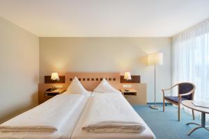Letto o letti in una camera di Hotel Weisses Kreuz