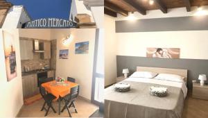 a bedroom with a bed and a table in a room at Casa Vacanze Antico Mercato in Marsala