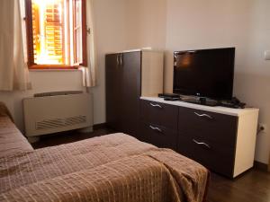Postel nebo postele na pokoji v ubytování Oldhouse Tučepi