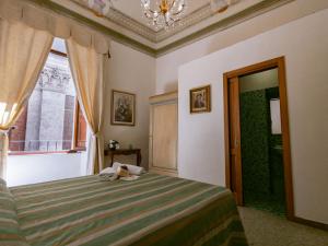 Posteľ alebo postele v izbe v ubytovaní B&B Siena In Centro - Diffuso