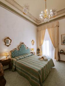 Posteľ alebo postele v izbe v ubytovaní B&B Siena In Centro - Diffuso