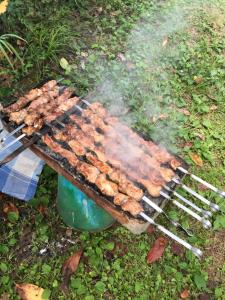 a grill with many different types of food on it at Старый дом! in Chakvi