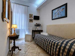 Posteľ alebo postele v izbe v ubytovaní B&B Siena In Centro - Diffuso