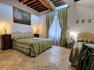 Posteľ alebo postele v izbe v ubytovaní B&B Siena In Centro - Diffuso
