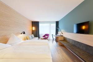 Letto o letti in una camera di Hotel Weisses Kreuz