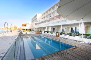 a swimming pool in front of a hotel at BG Nautico Ebeso in Ibiza Town