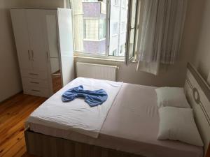 En eller flere senge i et værelse på Trabzon Airport Apartment