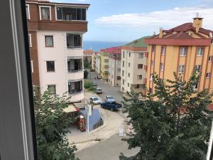 a view from a window of a street with buildings at Trabzon Airport Apartment in Trabzon