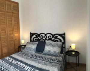 En eller flere senge i et værelse på Playa de Isora