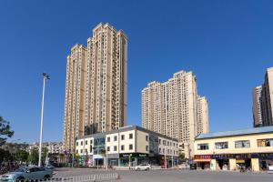 a group of tall buildings in a city at Wuhan Jiangan·Central hospital· in Jiang'an
