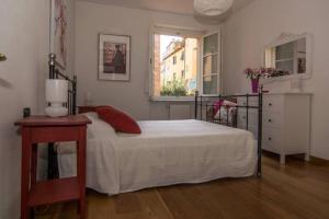 En eller flere senge i et værelse på Casa Piaggia