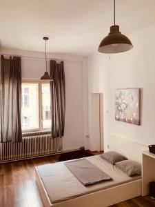 a bedroom with a bed and a window at Love Croatia Hostel-Mir Guesthouse Zagreb in Zagreb
