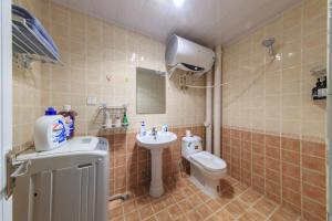 a bathroom with a sink and a toilet and a mirror at Baoding Lianchi·North China Electric Power University· in Baoding +26 photos