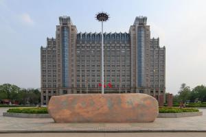 a large building with a clock in front of it at Baoding Lianchi·North China Electric Power University· in Baoding