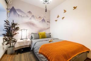 Ένα ή περισσότερα κρεβάτια σε δωμάτιο στο ZhengZhou JinShui·Kaide Square·