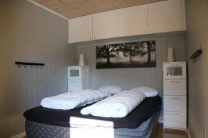 A bed or beds in a room at Myrkdalen Resort Vårstølen apartment
