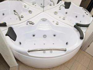 a white bath tub in a bathroom at 8 person holiday home in Ebeltoft in Ebeltoft