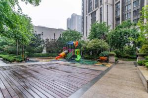 a playground in a park in a city at Zhengzhou Erqi · Erqi Wanda Complex · in Zhengzhou
