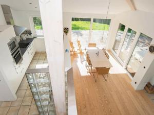 a kitchen and dining room with a table and chairs at 6 person holiday home in Knebel in Knebel
