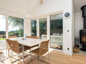 a dining room with a table and chairs at 6 person holiday home in Knebel in Knebel