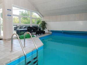 a swimming pool in a room with a swimming pool at 8 person holiday home in Gilleleje in Gilleleje