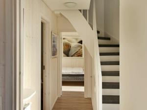 a hallway with stairs leading up to a house at Two-Bedroom Holiday home in Wendtorf 20 in Wendtorf