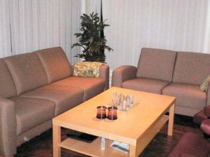 a living room with two couches and a coffee table at 10 person holiday home in Lindesnes in Spangereid