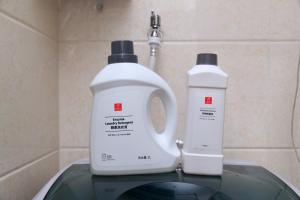 two bottles of laundry detergent sitting on top of a sink at Baoding Jingxiu·Beiguo Shopping Mall· in Baoding +27 photos