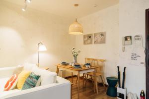 a living room with a table and a couch at [Roader] Wuhan Jiang'an District, Hong Kong Road in Wuhan