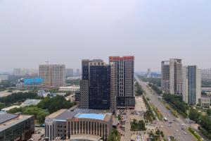 an aerial view of a city with tall buildings at Baoding Jingxiu·Beiguo Shopping Mall· in Baoding