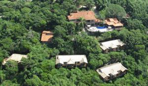 an aerial view of a house in the forest at Solar Mirador Exclusive Resort e SPA in Praia do Rosa