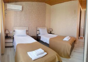 Кровать или кровати в номере Bonus Hotel