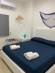 Ein Bett oder Betten in einem Zimmer der Unterkunft Arcorosa Apartment