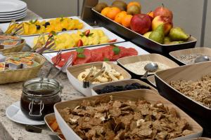 a table with many different types of food on it at City Hotel in Bydgoszcz +113 photos