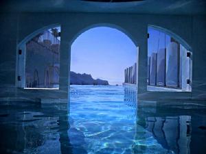 a swimming pool with a view of a body of water at Hotel Villa Fraulo in Ravello