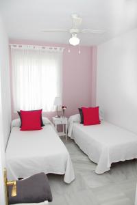 Posteľ alebo postele v izbe v ubytovaní Apartamento Centro Sanlucar
