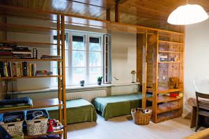 a bedroom with a bunk bed and a window at Spacious Klaipeda Apartment EV in Klaipėda