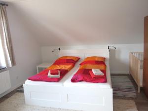 Ein Bett oder Betten in einem Zimmer der Unterkunft Ferienhaus "Auf dem Bremsberg"