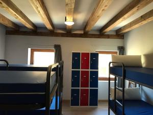 a room with two bunk beds and a window at Albergue Orion in Castrojeriz