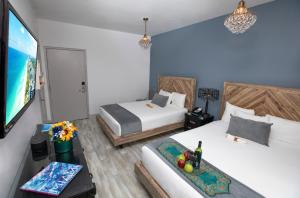 Postel nebo postele na pokoji v ubytování Whitelaw Hotel