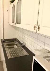 A cozinha ou cozinha compacta de Emerald Apartment Budapest