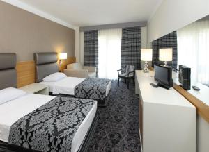Postel nebo postele na pokoji v ubytování Cettia Beach Resort