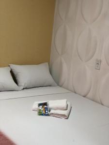 En eller flere senge i et værelse på POUSADA EXECUTIVE EXPRESS