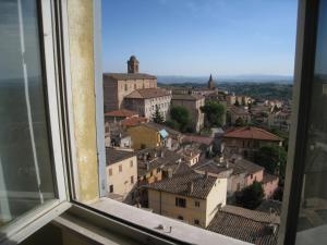 a view of a city from a window at Casa Mariotti in Perugia