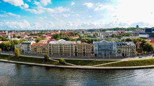 a view of a city with a river and buildings at Vilnius city best view apartments in Vilnius